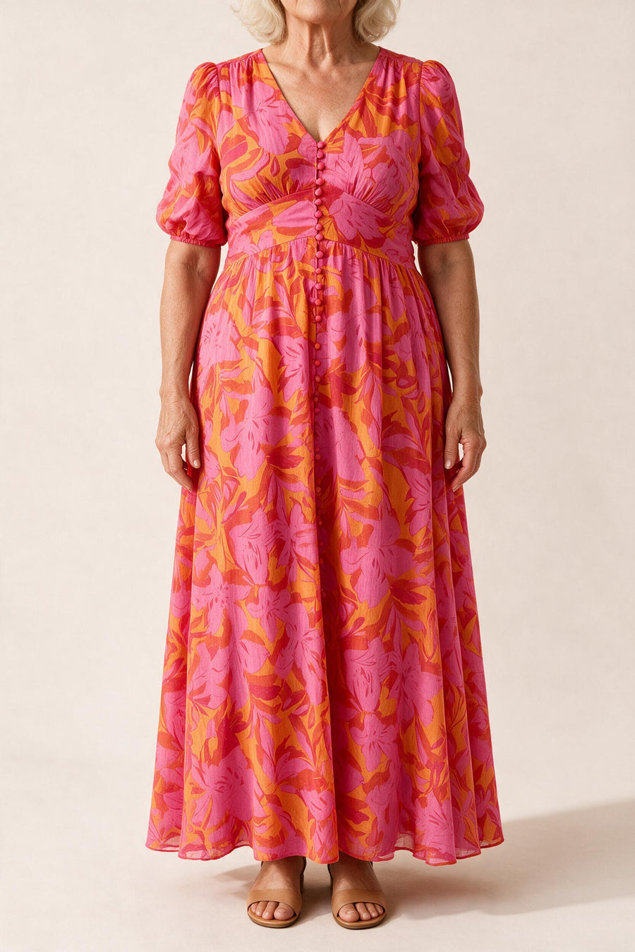 Robe longue Salomé — imprimé floral rose et orange, manches bouffantes et boutons recouverts, vue de face