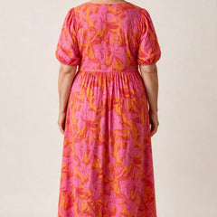 Robe longue Salomé vue de dos, encolure arrondie et manches bouffantes